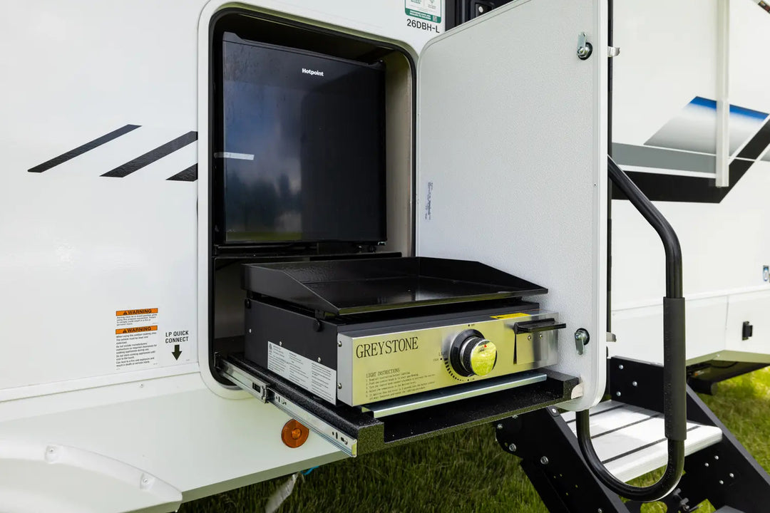 Portable outdoor kitchen with grill and fridge inside