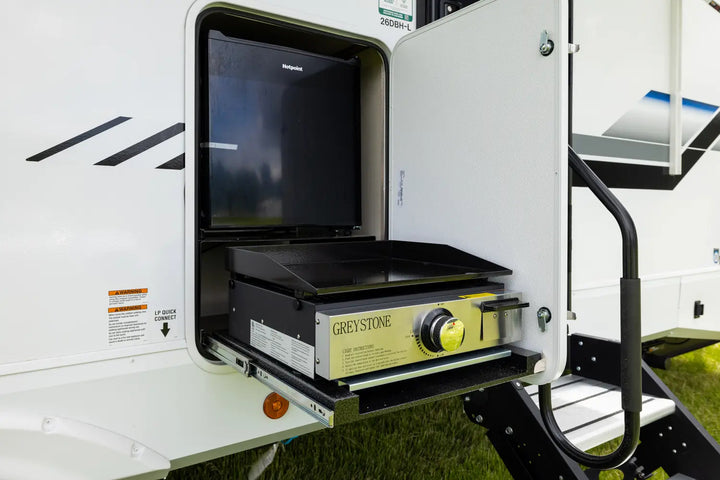 Portable outdoor kitchen with grill and fridge inside