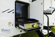 Portable outdoor kitchen with grill and fridge inside