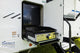 Portable outdoor kitchen with grill and fridge inside