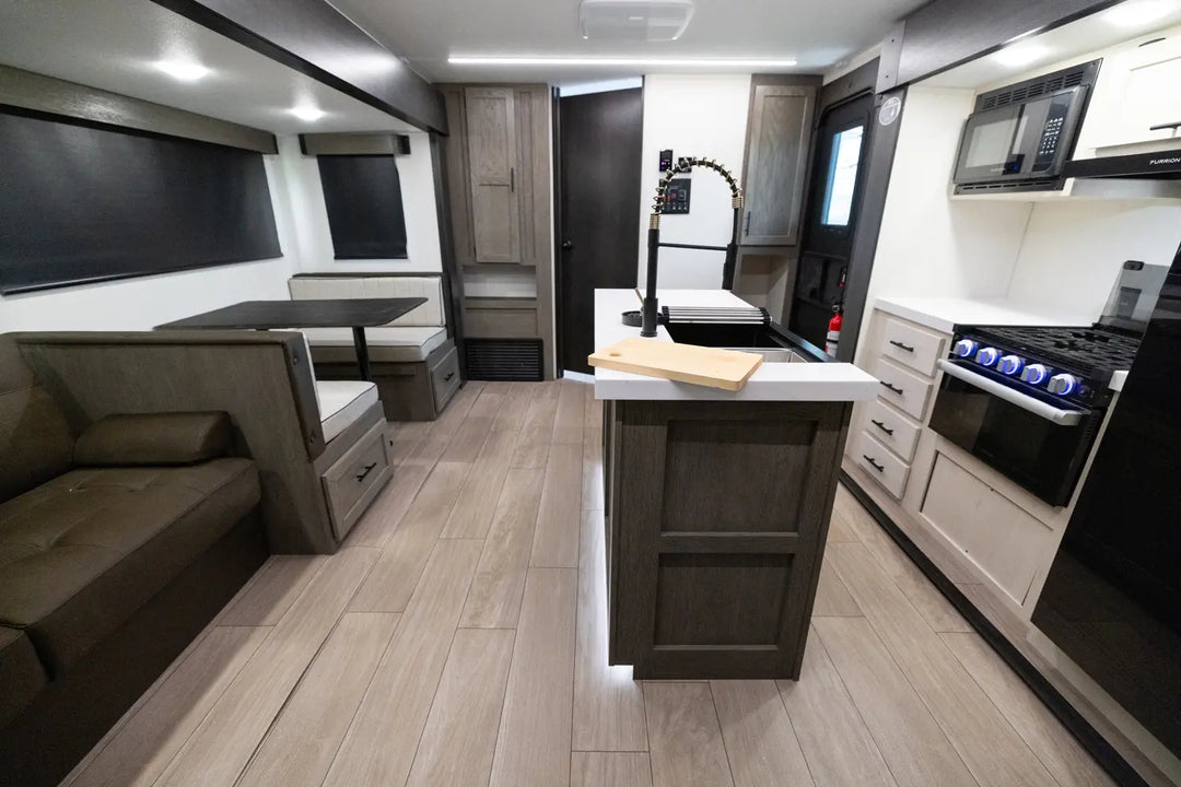 Modern RV interior with kitchen and living area