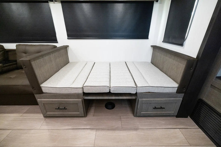 Sectional sofa bed with storage drawers in a compact living space