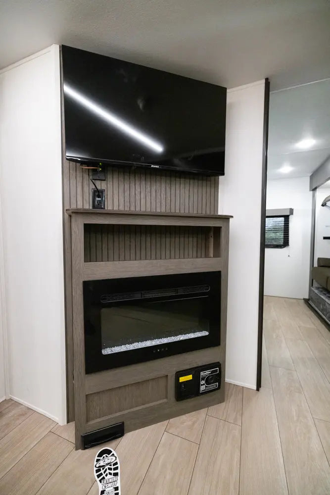 TV mounted above a fireplace in a modern interior setting.