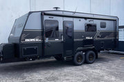 Black Villa Escape SE Family caravan 21' 6" parked in front of a building